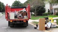 a red dump truck on a street